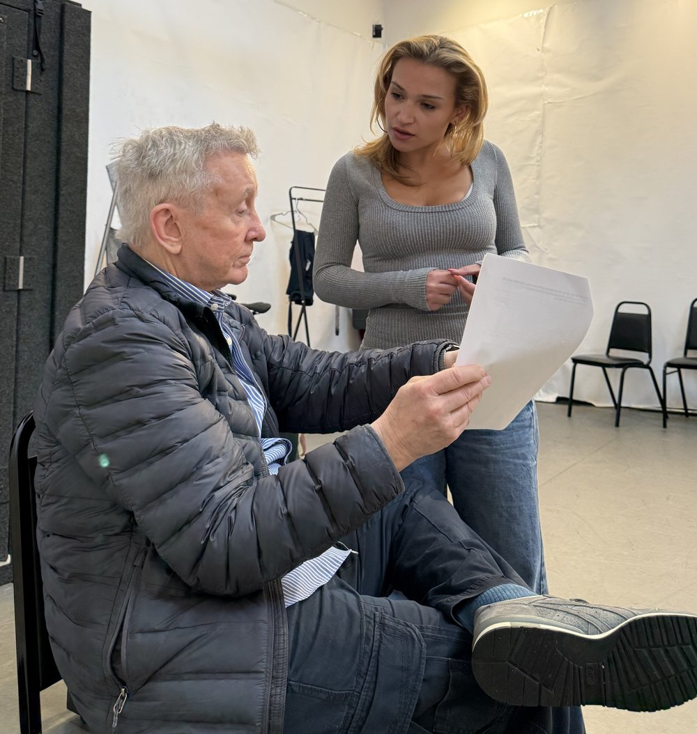 Paul Wagar reviewing a script with an actor in a rehearsal studio
